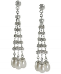 Show off your bold side. These drop earrings feature a stylish silhouette with cultured freshwater pearls (6-6-1/2 mm) adding an elegant touch. Crafted from sterling silver with a rhodium finish. Approximate drop length: 2-1/5 inches. Approximate drop width: 1/2 inch. Show off your bold side. These drop earrings feature a stylish silhouette with cultured freshwater pearls (6-6-1/2 mm) adding an elegant touch. Crafted from sterling silver with a rhodium finish. Approximate drop length: 2-1/5 inches. Approximate drop width: 1/2 inch.