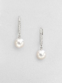 A column of dazzling diamonds set in 18k white gold accent this elegant Akoya pearl drop design. 7.5mm round white Akoya pearlsDiamonds, .08 tcw18k white goldDrop, about 1Lever backImported A column of dazzling diamonds set in 18k white gold accent this elegant Akoya pearl drop design. 7.5mm round white Akoya pearlsDiamonds, .08 tcw18k white goldDrop, about 1Lever backImported