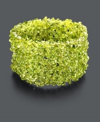 Go green in a whole new way with this organic cuff. Bracelet features bright green peridot chips (4-6 mm) and stretches to fit the wrist. Approximate length: 4 inches. Go green in a whole new way with this organic cuff. Bracelet features bright green peridot chips (4-6 mm) and stretches to fit the wrist. Approximate length: 4 inches.
