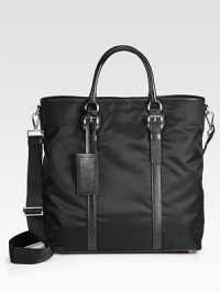 An everyday essential, handsomely crafted in tessuto nylon, trimmed with textured saffiano leather.Snap button closureDouble top handlesAdjustable shoulder strapInterior zip pocketNylon15W x 15H x 7DMade in Italy