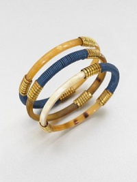 A set of three recycled horn bangles wrapped in brass and Greek leather. Greek leather cordRecycled brassRecycled Ankole cow hornSmall/medium diameter, 2.5Medium/large diameter, 3 Slip-on styleImported A set of three recycled horn bangles wrapped in brass and Greek leather. Greek leather cordRecycled brassRecycled Ankole cow hornSmall/medium diameter, 2.5Medium/large diameter, 3 Slip-on styleImported