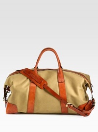 An ideal size for travel, this heritage duffel is rendered in durable leather with a removable reinforced leather shoulder strap for versatile on-the-go styling.Zip closureDouble top handlesAdjustable shoulder strapInterior zip pocketEmbossed signature leather luggage tagReinforced with leather at the bottomCotton twill liningLeather24W x 12H x 10DImported An ideal size for travel, this heritage duffel is rendered in durable leather with a removable reinforced leather shoulder strap for versatile on-the-go styling.Zip closureDouble top handlesAdjustable shoulder strapInterior zip pocketEmbossed signature leather luggage tagReinforced with leather at the bottomCotton twill liningLeather24W x 12H x 10DImported