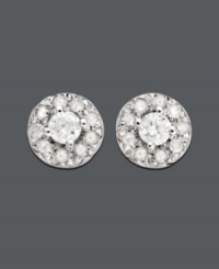 Dust your earlobes with diamond studs. Practical for every occasion, these circular studs feature one central round-cut diamond surrounded by slightly smaller round-cut diamonds (1/4 ct. t.w.) at the edges. Earrings crafted in 14k white gold. Approximate diameter: 1/4 inch. Dust your earlobes with diamond studs. Practical for every occasion, these circular studs feature one central round-cut diamond surrounded by slightly smaller round-cut diamonds (1/4 ct. t.w.) at the edges. Earrings crafted in 14k white gold. Approximate diameter: 1/4 inch.