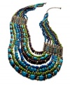 Perfect your party look with bold beading in vibrant colors. Style&co.'s multi-strand statement necklace combines blue, green, and wooden beads in gold tone mixed metal. Approximate length: 22-1/2 inches to 30-1/2 inches + 3-1/2-inch extender. Approximate drop: 3-1/2 inches.