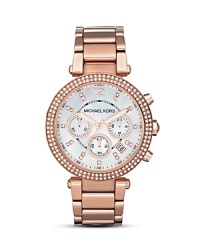 A gleaming mother of pearl dial is framed by a Swarovski crystal encrusted bezel in this glamorous timepiece from Michael Kors. A gleaming mother of pearl dial is framed by a Swarovski crystal encrusted bezel in this glamorous timepiece from Michael Kors.