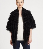Luxurious rabbit fur with lace insets and trim in a statement-making style that exudes romanticism.Dyed rabbit furOpen frontThree-quarter sleevesAbout 36 from shoulder to hem80% rayon/20% nylon laceSpot cleanImportedRabbit fur origin: China