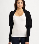 A chic, structured mutton sleeve lends unique style to this lightweight knit shrug.Open frontMutton sleeves with extra long cuffsAbout 10 from shoulder to hem80% rayon/20% nylonDry cleanImported