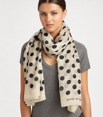 Spotted like a dalmatian, this ultra-soft, wool-blend wrap features a bold polka dot design and logo detail.Wool53 X 70Dry cleanImported