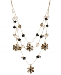 Call of the wild. Betsey Johnson's fierce illusion necklace is embellished with brown leopard flower charms, gold tone roses, black faceted and glass pearl beads and small crystal accents. Crafted in antiqued gold tone mixed metal. Approximate length: 16 inches + 3-inch extender. Approximate drop: 3-1/2 inches. Call of the wild. Betsey Johnson's fierce illusion necklace is embellished with brown leopard flower charms, gold tone roses, black faceted and glass pearl beads and small crystal accents. Crafted in antiqued gold tone mixed metal. Approximate length: 16 inches + 3-inch extender. Approximate drop: 3-1/2 inches.