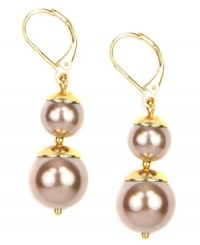 Double the fun. AK Anne Klein's classy double drop earrings feature rosy faux-pearls and golden details. Crafted in gold tone mixed metal, they're suitably stylish for daytime or evening. Approximate drop: 1-1/2 inch. Double the fun. AK Anne Klein's classy double drop earrings feature rosy faux-pearls and golden details. Crafted in gold tone mixed metal, they're suitably stylish for daytime or evening. Approximate drop: 1-1/2 inch.