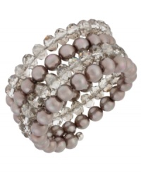 Wrap star. This coil bracelet from Kenneth Cole New York is crafted from silver-tone mixed metal with taupe glass pearls and cherry beads making a bold fashion statement. Item comes packaged in a signature Kenneth Cole New York Gift Box. Approximate length: 7-1/2 inches. Approximate width: 1-1/4 inches. Wrap star. This coil bracelet from Kenneth Cole New York is crafted from silver-tone mixed metal with taupe glass pearls and cherry beads making a bold fashion statement. Item comes packaged in a signature Kenneth Cole New York Gift Box. Approximate length: 7-1/2 inches. Approximate width: 1-1/4 inches.
