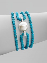 A glistening baroque pearl, surrounded by strands of turquoise beads, is accented by sparkling cubic zirconia. 14mm baroque pearl Cubic zirconia Sterling silver Length, about 7½ Lobster clasp Made in Spain A glistening baroque pearl, surrounded by strands of turquoise beads, is accented by sparkling cubic zirconia. 14mm baroque pearl Cubic zirconia Sterling silver Length, about 7½ Lobster clasp Made in Spain