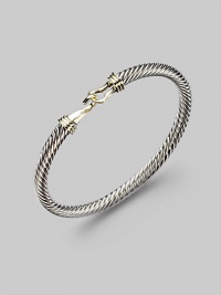 From the Cable Buckle Collection. A twisted cable of sterling silver, buckled in 14k gold. Sterling silver and 14k yellow gold Cable, 5mm Diameter, about 2¼ Hook clasp Made in USA From the Cable Buckle Collection. A twisted cable of sterling silver, buckled in 14k gold. Sterling silver and 14k yellow gold Cable, 5mm Diameter, about 2¼ Hook clasp Made in USA