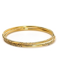 Melinda Maria's set of three gold bangles are a perfect complement to breezy bohemian looks. Wear the stack solo, or copy the cool-girls with a gilded wristful. Melinda Maria's set of three gold bangles are a perfect complement to breezy bohemian looks. Wear the stack solo, or copy the cool-girls with a gilded wristful.