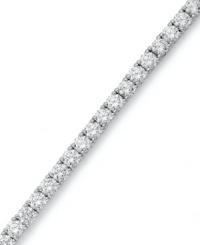 The perfect serve. Arabella's stunning tennis bracelet combines dozens of round-cut Swarovski zirconias (20-1/4 ct. t.w.) in polished sterling silver. Approximate length: 7 inches. The perfect serve. Arabella's stunning tennis bracelet combines dozens of round-cut Swarovski zirconias (20-1/4 ct. t.w.) in polished sterling silver. Approximate length: 7 inches.