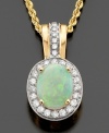 A beautiful oval-cut opal center accent gives an almost mysterious quality to this gorgeous pendant. Featuring round-cut diamonds (1/3 ct. t.w.) and opal (1-1/2 ct. t.w.) set in 14k gold. Approximate length: 18 inches. Approximate drop: 3/4 inch.