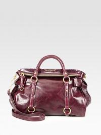 Leather carryall featuring sweet bow accents.Double top handles, 4 dropDetachable shoulder strap, 21½ dropTop zip closureProtective metal feetOne inside zip pocketThree inside open pocketsSatin lining13W X 9H X 6DMade in Italy Leather carryall featuring sweet bow accents.Double top handles, 4 dropDetachable shoulder strap, 21½ dropTop zip closureProtective metal feetOne inside zip pocketThree inside open pocketsSatin lining13W X 9H X 6DMade in Italy