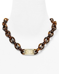 Michael Kors' shows its mastery of ever-chic style with this plated metal necklace, accented by retro tortoise shell links. Michael Kors' shows its mastery of ever-chic style with this plated metal necklace, accented by retro tortoise shell links.
