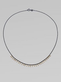 A delicate design with 14k gold beads on oxidized sterling silver chain. 14k gold beadsOxidized sterling silverLength, about 16Spring ring closureMade in USA A delicate design with 14k gold beads on oxidized sterling silver chain. 14k gold beadsOxidized sterling silverLength, about 16Spring ring closureMade in USA