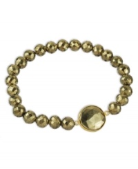 Glitz & glamour. Faceted pyrite beads (99 ct. t.w.) reflect the light on this sparkling 18k gold over sterling silver bracelet. Bracelet stretches to fit wrist. Approximate length: 7-1/2 inches. Glitz & glamour. Faceted pyrite beads (99 ct. t.w.) reflect the light on this sparkling 18k gold over sterling silver bracelet. Bracelet stretches to fit wrist. Approximate length: 7-1/2 inches.