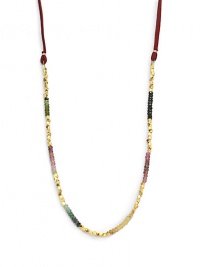 THE LOOKTourmaline detailsGoldplated nugget accentsFaux suede cord18k yellow goldplated brassTie closureTHE MEASUREMENTLength, about 36ORIGINMade in USA THE LOOKTourmaline detailsGoldplated nugget accentsFaux suede cord18k yellow goldplated brassTie closureTHE MEASUREMENTLength, about 36ORIGINMade in USA