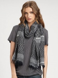 A heathered style, carefully woven with yarns of multiple weights for a textured design with a fun fringe. 40% wool/30% polyacrylic/30% polyamideAbout 77 X 18Dry cleanMade in Italy of imported fabrics A heathered style, carefully woven with yarns of multiple weights for a textured design with a fun fringe. 40% wool/30% polyacrylic/30% polyamideAbout 77 X 18Dry cleanMade in Italy of imported fabrics