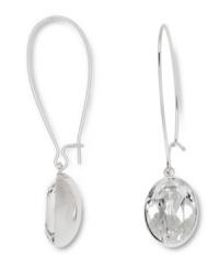 Sophisticated and stunning. The simple silhouette of Swarovski's Puzzle earrings is enhanced by a beautiful bezel-set clear crystal. Set in silver tone mixed metal. Approximate diameter: 1 inch. Approximate drop: 1-1/2 inches. Sophisticated and stunning. The simple silhouette of Swarovski's Puzzle earrings is enhanced by a beautiful bezel-set clear crystal. Set in silver tone mixed metal. Approximate diameter: 1 inch. Approximate drop: 1-1/2 inches.