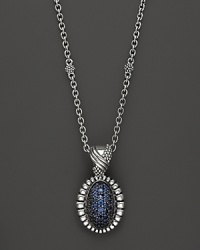 Shining blue sapphires are trimmed in fluted sterling silver on this Lagos pendant necklace. Shining blue sapphires are trimmed in fluted sterling silver on this Lagos pendant necklace.