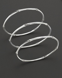 From the Bamboo collection, a set of 3 bamboo-inspired bangles, designed by John Hardy. From the Bamboo collection, a set of 3 bamboo-inspired bangles, designed by John Hardy.
