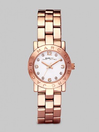 A classic style with a touch of sparkle and an iconic logo bezel. Quartz movementWater resistant to 3 ATMRound rose goldtone ion-plated stainless steel case, 26mm (1) Logo bezelWhite dialCrystal and numeric hour markersSecond hand Rose goldtone ion-plated stainless steel link braceletImported A classic style with a touch of sparkle and an iconic logo bezel. Quartz movementWater resistant to 3 ATMRound rose goldtone ion-plated stainless steel case, 26mm (1) Logo bezelWhite dialCrystal and numeric hour markersSecond hand Rose goldtone ion-plated stainless steel link braceletImported