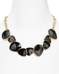 Geometric discs are a bold focal point on this Kenneth Jay Lane necklace, with a simple gold chain as the compliment. Geometric discs are a bold focal point on this Kenneth Jay Lane necklace, with a simple gold chain as the compliment.