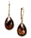 Take your look to the next level with the right amount of color. Pear-cut smokey topaz (10 ct. t.w.) adds the sparkle to these shining 14k gold earrings with diamond accents. Approximate drop: 1-1/4 inches.