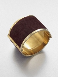 A wide hinged cuff is both edgy and elegant in polished brass with a center panel of sleek pony hair.Pony hairBrassDiameter, about 2Hinge-and-pin claspMade in Italy A wide hinged cuff is both edgy and elegant in polished brass with a center panel of sleek pony hair.Pony hairBrassDiameter, about 2Hinge-and-pin claspMade in Italy