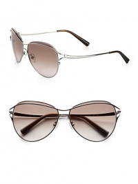 Feminine aviator frames in shiny metal with metal logo temples. Available in gunmetal with grey gradient lens.Metal temples100% UV protectionMade in Italy Feminine aviator frames in shiny metal with metal logo temples. Available in gunmetal with grey gradient lens.Metal temples100% UV protectionMade in Italy