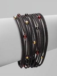 From the Black and Gold Chain Collection. Beautiful garnet, hematite and 18k gold beads accent this blackened sterling silver box chain design. Garnet, hematite and 18k gold beadsBlackened sterling silverLength, about 7½Push clasp closureImported 