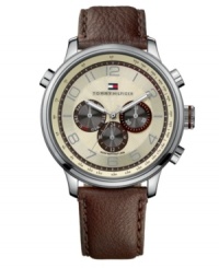 An new take on traditional, this watch by Tommy Hilfiger keeps things interesting with texture. Brown leather strap and round stainless steel case. Parchment chronograph dial with textured inner dial features silver tone numerals, three subdials, luminous hands and logo at twelve o'clock. Quartz movement. Water resistant to 50 meters. Ten-year limited warranty.