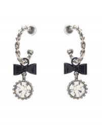 Chic hoops with an extra touch of flirtation. Betsey Johnson earrings feature quarter hoops decorated with bow and round-cut crystal charms. Crafted in silver tone mixed metal. Approximate drop: 2 inches. Chic hoops with an extra touch of flirtation. Betsey Johnson earrings feature quarter hoops decorated with bow and round-cut crystal charms. Crafted in silver tone mixed metal. Approximate drop: 2 inches.