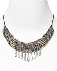 Rock the casbah with this engraved statement necklace from Vanessa Mooney. Crafted of silver plate with hanging beads, it's a perfect way to take this season's exotic influences to your jewel box. Rock the casbah with this engraved statement necklace from Vanessa Mooney. Crafted of silver plate with hanging beads, it's a perfect way to take this season's exotic influences to your jewel box.