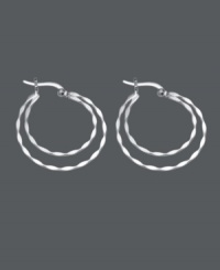 Stylish hoops that make a statement. This unique design by Unwritten features two, graduated, twisted hoops in a sterling silver setting. Approximate diameter: 1-1/5 inches. Stylish hoops that make a statement. This unique design by Unwritten features two, graduated, twisted hoops in a sterling silver setting. Approximate diameter: 1-1/5 inches.