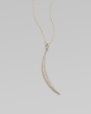 A slender slip of a crescent moon, long and lyrical, sparkles with diamonds and dangles from a gold barley chain.Diamonds, .17 tcw14k yellow gold and sterling silverChain length, about 18Pendant length, about 2Spring ring claspMade in USA