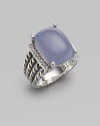 From the Wheaton Collection. A faceted cushion of milky blue chalcedony, edged by rows of diamonds, in a wide cable band of sterling silver. Diamonds, 0.16 tcw Blue chalcedony and diamonds Sterling silver Width, about ½ Imported 