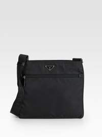 Tessuto nylon messenger with saffiano leather trim and adjustable shoulder strap.Top zip closure One outside zip pocket One inside zip pocket Triangle metal and enamel Prada logo Logo lining 12W X 10H X 2¾D Made in Italy Tessuto nylon messenger with saffiano leather trim and adjustable shoulder strap.Top zip closure One outside zip pocket One inside zip pocket Triangle metal and enamel Prada logo Logo lining 12W X 10H X 2¾D Made in Italy
