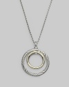 Double circles, one of cabled sterling silver, the other of smooth 18k gold, make a pretty pairing hanging from a silver box chain. Sterling silver and 18k yellow gold Chain length, about 17 to 18 Pendant diameter, about 1¼ Lobster clasp Imported