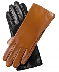 A classic always stays in style. These sumptuous leather gloves from Lauren by Ralf Lauren are effortlessly chic and accented with fine stitching at the seams and logo-embossed detailing at the cuff. A classic always stays in style. These sumptuous leather gloves from Lauren by Ralf Lauren are effortlessly chic and accented with fine stitching at the seams and logo-embossed detailing at the cuff.