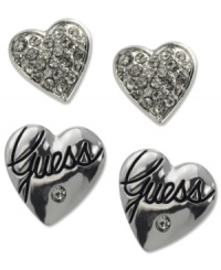 Embrace your love to mix and match. This darling duo set from GUESS features two pair of heart-shaped studs -- one with a jet epoxy logo, the other with shiny pave stones. Crafted in silver tone mixed metal. Approximate diameter: 1 inch. Embrace your love to mix and match. This darling duo set from GUESS features two pair of heart-shaped studs -- one with a jet epoxy logo, the other with shiny pave stones. Crafted in silver tone mixed metal. Approximate diameter: 1 inch.