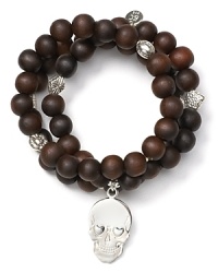 Bold and oh so bohemian, this set of beaded bracelets from Good Charma is ready to start an arm party. Stack these wooded beauties up to accent the tough-chic sterling silver skull charm. Bold and oh so bohemian, this set of beaded bracelets from Good Charma is ready to start an arm party. Stack these wooded beauties up to accent the tough-chic sterling silver skull charm.