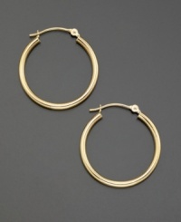 Polished 18k gold hoop earrings radiate classic elegance (22 mm). Polished 18k gold hoop earrings radiate classic elegance (22 mm).