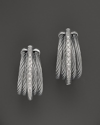 Charriol details 18K white gold with diamonds on the Nautical Cable earrings from the Classique collection. Charriol details 18K white gold with diamonds on the Nautical Cable earrings from the Classique collection.
