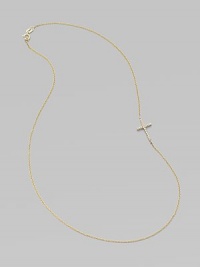 A wispy chain of 14k yellow gold features a cross pendant, encrusted in sparkling diamonds, set askew for a modern edge.Diamonds, .14 tcw 14k yellow gold Length, about 16 Pendant length, about ½ Spring ring clasp Made in USA A wispy chain of 14k yellow gold features a cross pendant, encrusted in sparkling diamonds, set askew for a modern edge.Diamonds, .14 tcw 14k yellow gold Length, about 16 Pendant length, about ½ Spring ring clasp Made in USA