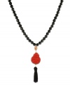 Eastern expressionism. This stunning necklace features shiny onyx beads (240 ct. t.w.), a carved cinnabar buddha pendant, and a black nylon tassel. Set in 18k gold over sterling silver. Approximate length: 30 inches. Approximate drop: 4 inches.